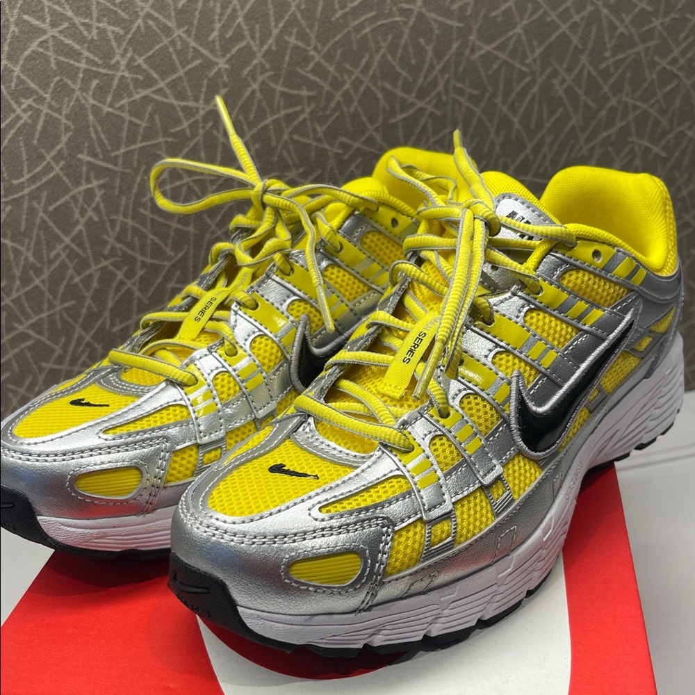 NEW. Nike Silver and Yellow Athletic Shoes